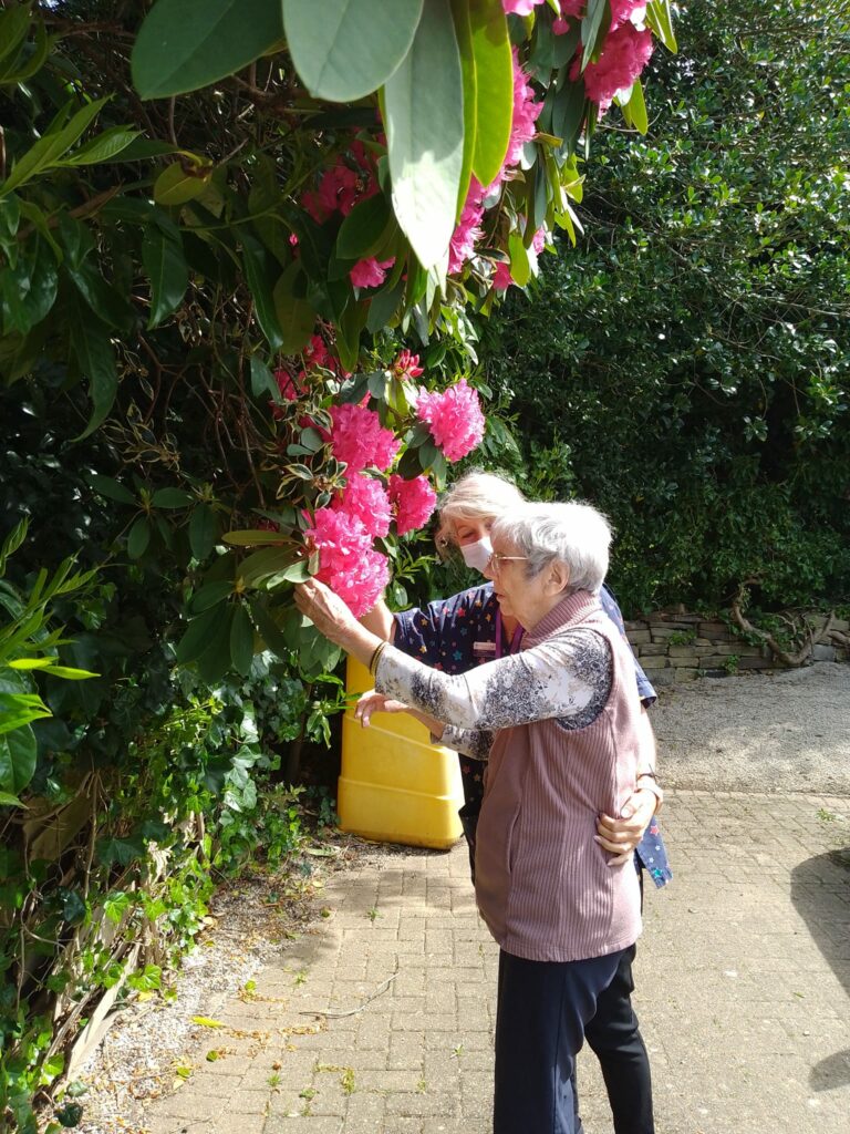 resident picking flowers